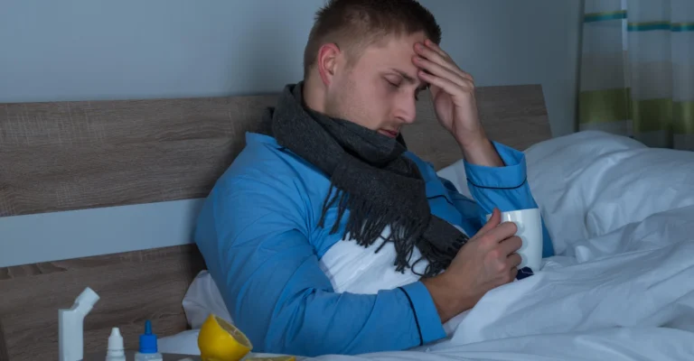 man-suffering-from-headache-sitting