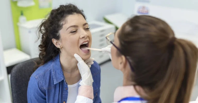 female-patient-opening-her-mouth-doctor