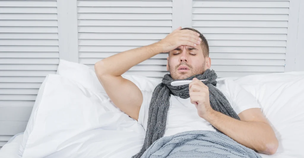 portrait-young-man-lying-bed-checking