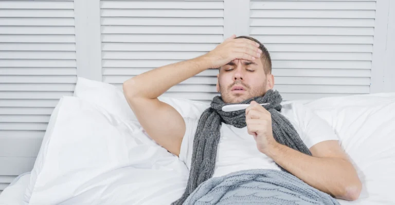 portrait-young-man-lying-bed-checking