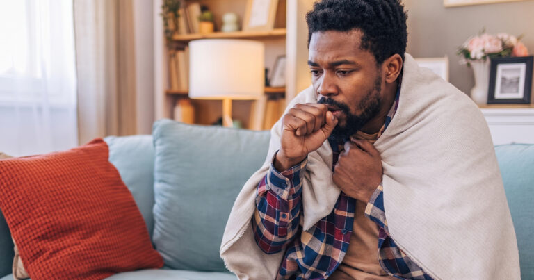 Sick man coughing from pneumonia without fever